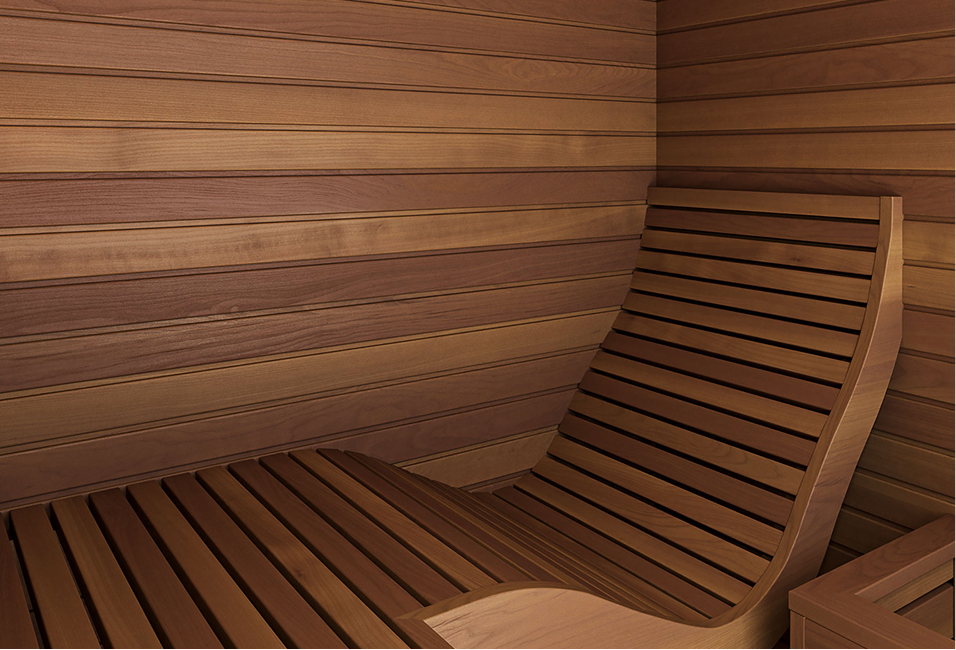 Wooden sauna interior with curved bench