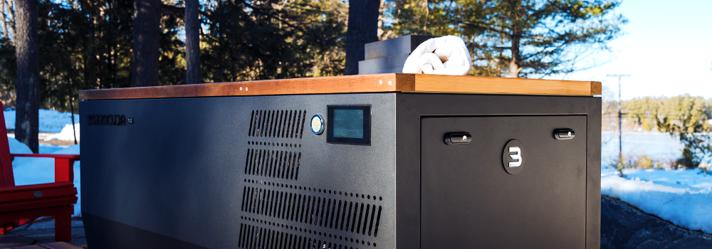 Muskoka Sauna's modern cold plunge tub with a sleek black design and cedar top, set outdoors in a winter landscape—perfect for contrast therapy and post-sauna recovery.