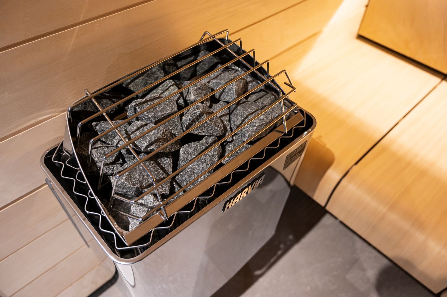 Metal grill with charcoal on a wooden surface