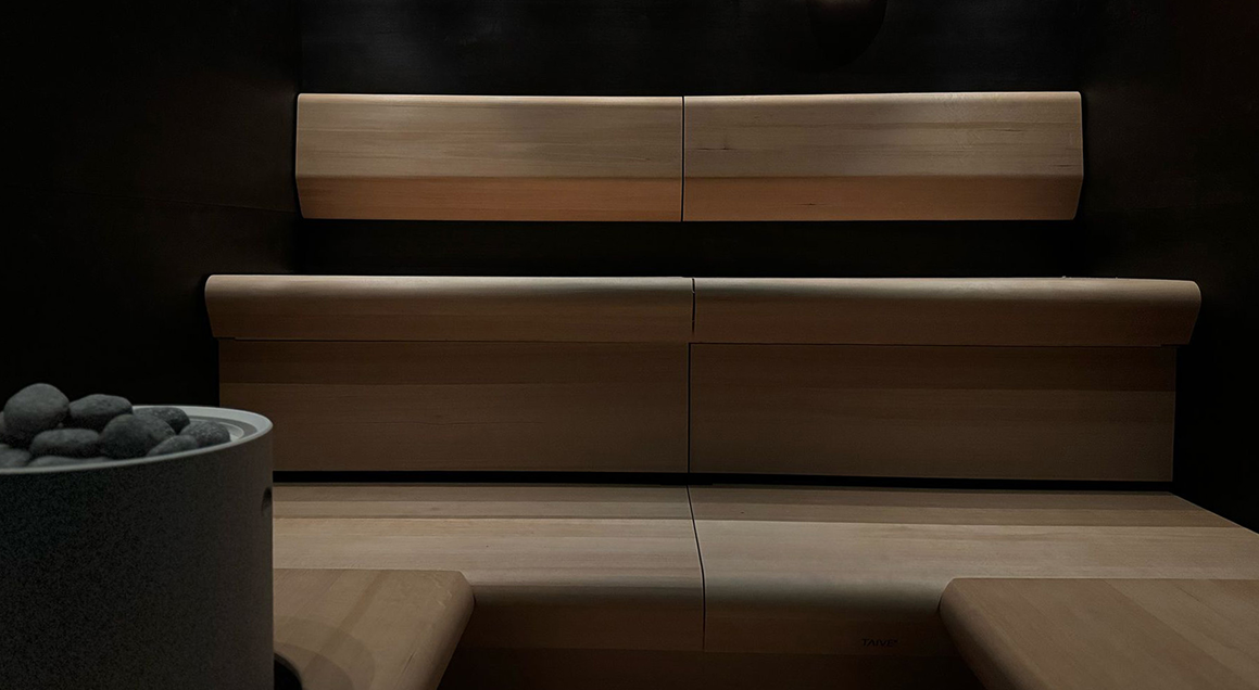 Wooden bench with a dark background